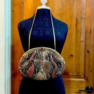 This is a Judith Lieber snake anaconda purse